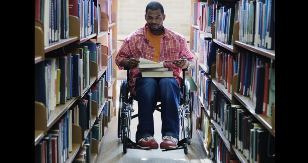 Man in wheelchair in library