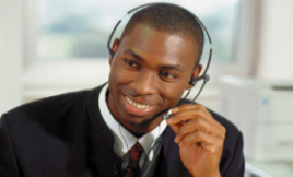 Man with a a headset, person on the phone helping a customer.